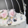 teardrop crystal drops on this wedding cake topper