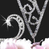 close-up of this crystal wedding cake monogram topper