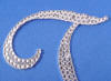 swarovski clear crystals cover the silver plated letter t