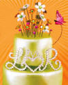 VDC crystal monogram with heart, crystal flowers, and butterfly on top of wedding cake