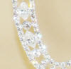clear swarovski marquise, diamond, and round crystals make-up these detailed monogram wedding cake toppers