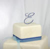 this initial e monogram full crystal cake topper is in 2 blue crystal colors and cotillion font