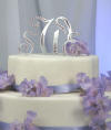 solid metal monogram wedding cake topper accented with swarovski crystals