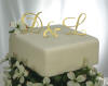 monogram wedding cake topper in gold mirror acrylic