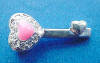 sterling silver key charm with pink heart surrounded by cubic zirconia stones