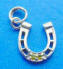 sterling silver horseshoe charm with two yellow cubic zirconia stones