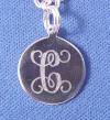 front side has the initial C for the flower girl's first name in the interlock font