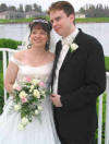 Tracey is wearing a 14k gold single pearl drop necklace and earring set on her wedding day.