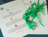 Christmas cake charms on green ribbons