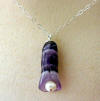 notice the beautiful range of colors in this genuine amethyst calla lily pendant