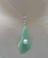 aventurine has almost silver and blue highlight tones to the beautiful light-medium green color