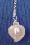 there is a pastel pink freshwater pearl inside this mother of pearl calla lily bridesmaid wedding necklace