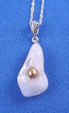 close-up of mother of pearl calla lily pendant with bronze freshwater pearl center