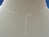 there is a 2" extender on the back of this sterling silver necklace with a dangling genuine cultured freshwater pearl