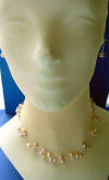 5-strand peach/pink pearl illusion necklace and earrings