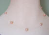 single-strand peach/pink pearl illusion necklace