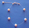 single-strand pink/peach pearl illusion bracelet