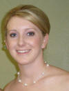 This Maid of Honor is wearing our Swarovski crystal pearl and organza necklace.