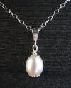 this wedding pearl necklace features sterling silver accents such as decorative beadcaps and a necklace bail