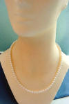 This handcrafted freshwater pearl necklace is 20 inches in length.