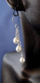 this pair of pearl earrings dangle approx 2 inches