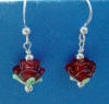 these sterling silver frenchwire earrings have handmade red rose lampwork beads and sterling silver accent beads
