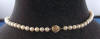 14k gold round clasp on the back of this akoya pearl necklace