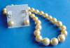 graduated shell pearl necklace and leverback earrings