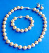golden shell pearl necklace, bracelet and earrings