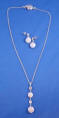 Coin pearl necklace with one single drop in front of 2 coin pearls and 2 cubic zirconia stones with matching earrings