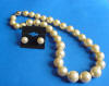golden shell pearl necklace and earrings