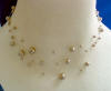 bridesmaid's triple-strand illusion necklace made with bronze Swarovski(tm) crystal pearls
