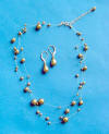 triple-strand bronze crystal pearl necklace and earrings