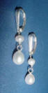 special request pearl earrings - a round pearl is added at the top and the teardrop pearl dangles below