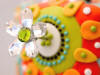 fun colorful cake with flower style 4 in clear crystal petals and olivine center