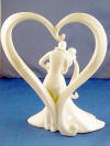 glazed porcelain bride and groom with heart wedding cake topper called stylish embrace