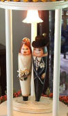 these are actually handpainted gourds as the bride and groom in the center of this towel cake - so cute!