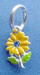 sterling silver yellow enamel sunflower with green enamel leaves and a blue crystal in the center