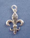 sterling silver fleur de leis charm with open scrollwork design