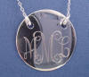 sorry for the camera reflection but the pendant is so shiny it is hard to get a picture of the engraving