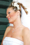 Richele has on a double-strand pearl and crystal illusion necklace (the Cross necklace is her necklace), bracelet and earrings on her wedding day.