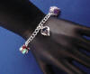 sterling silver charm bracelet with enamel charms and birthstone charm