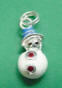 sterling silver white enamel snowman with blue enamel hat, black enamel eyes, and red rhinestone buttons charm