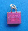 sterling silver 3-d pink enamel says "shopping mom" on this side of the charm