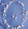 a bride's 5-strand pearl and crystal illusion necklace and leverback earrings wedding jewelry set
