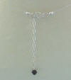 The back of the 3-pearl (or 3-crystal) necklace is a sterling silver clasp and 2" extender