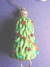 handcrafted christmas tree lampwork bead on this ornament hanger