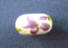 purple iris flowers on white ceramic bead