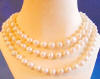 here is the rope pearl necklace worn as a triple-strand pearl necklace