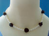 the rose beads in this necklace are hand-carved genuine black onyx